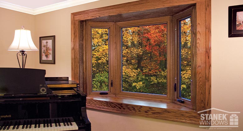 Walnut-colored bay window with inside shelf